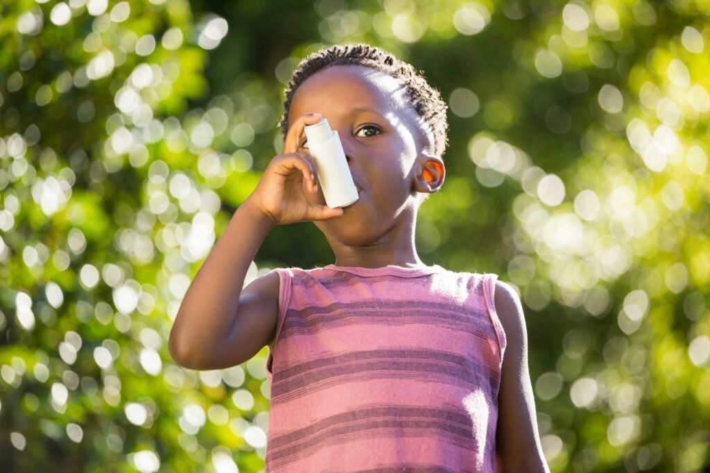 Boy using a asthma inhalator